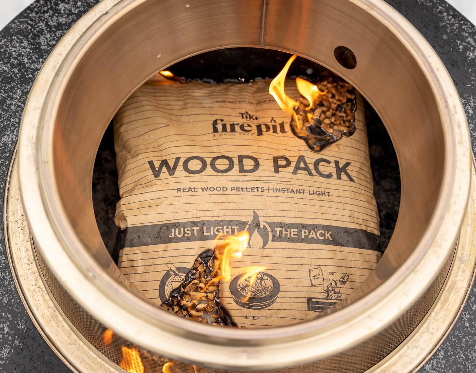 TIKI Brand Wood Pack lit corners in fire pit