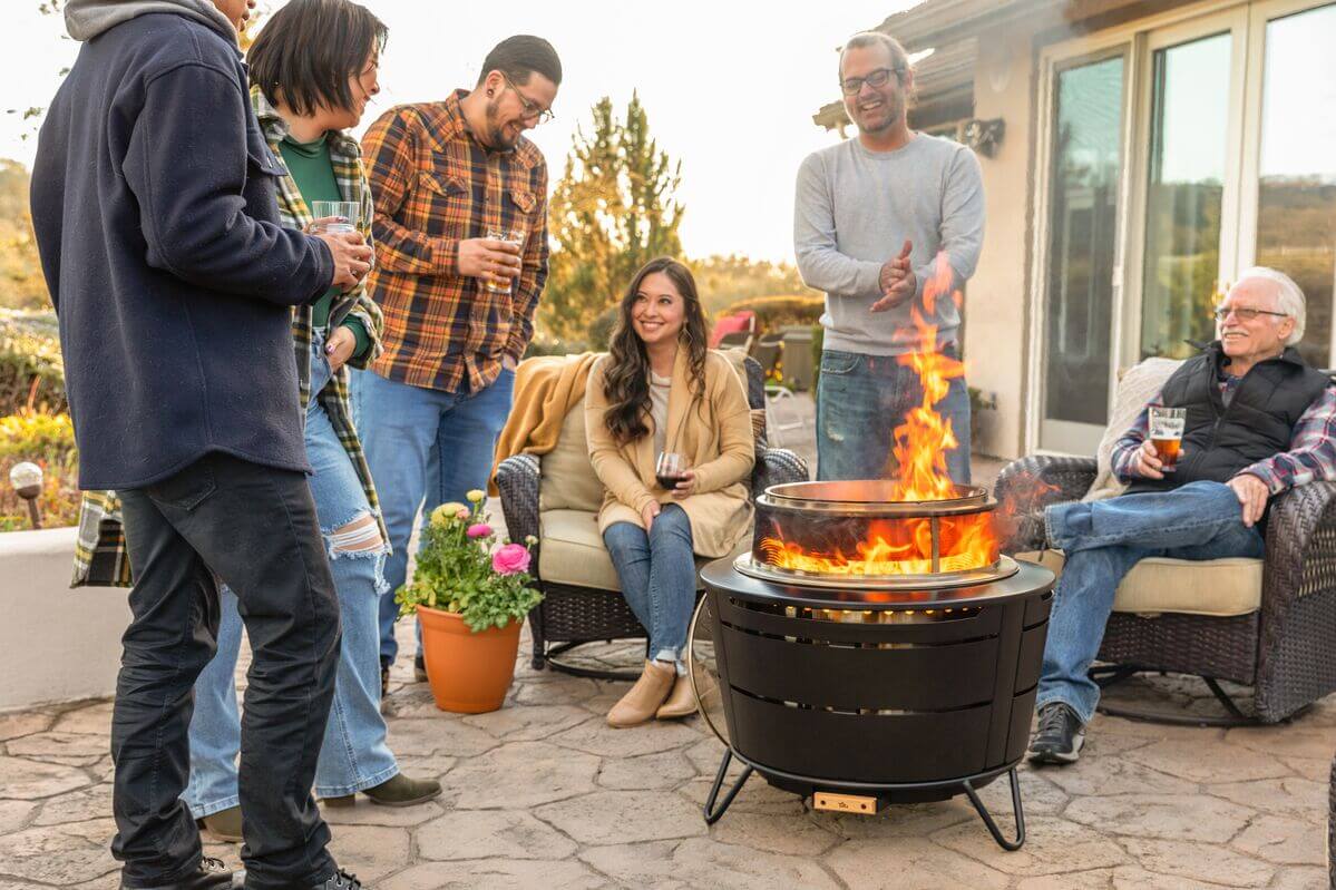 group of friends hanging out around the fire